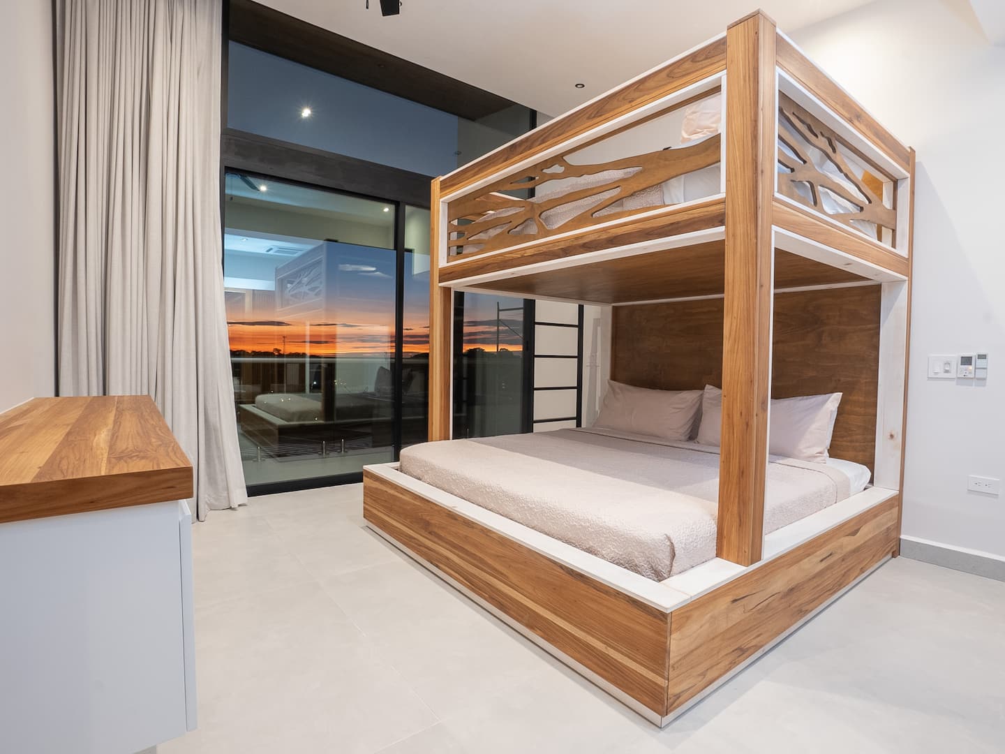 Second bedroom with a queen-over-king bunk and ocean views
